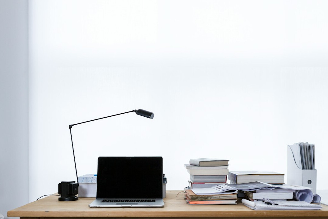 Laptop showing market analytics on a desk